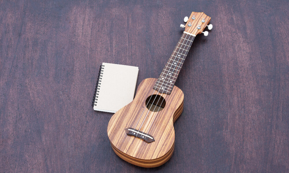 ukulele with notebook