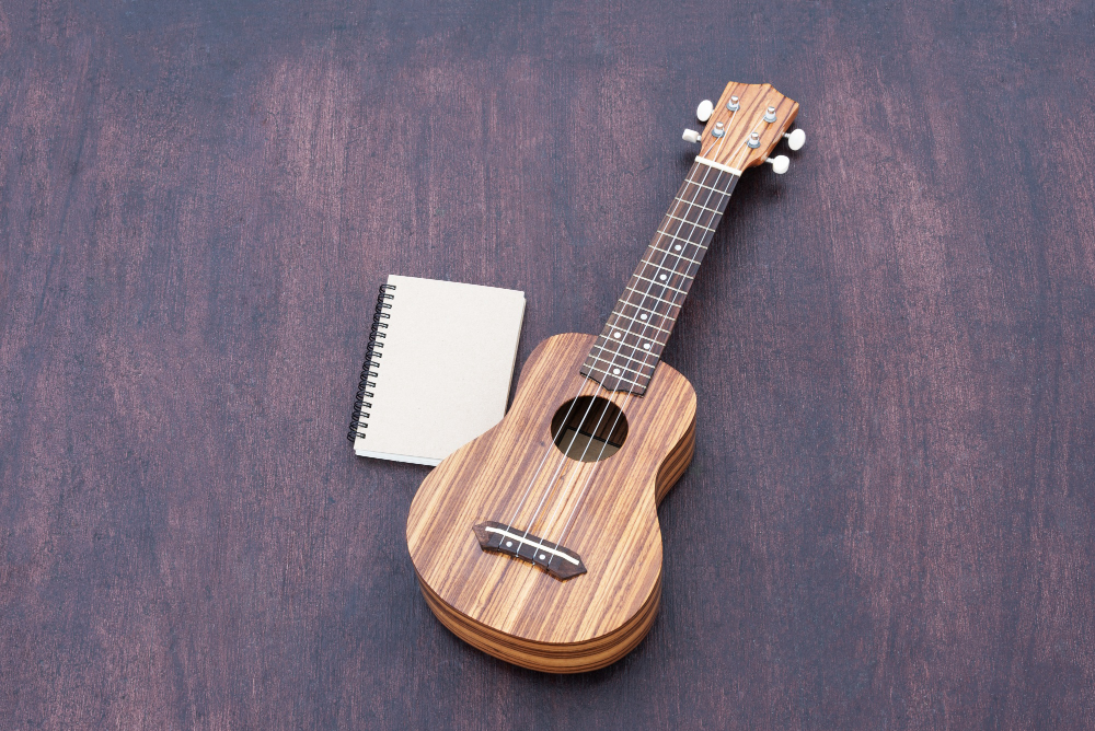 ukulele with notebook